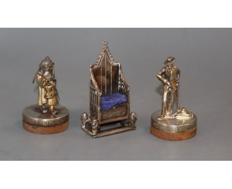 An Edwardian silver Coronation chair pin cushion, Birmingham, 1901 and two modern silver gilt figures.