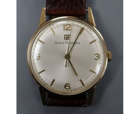 A gentleman's 9ct gold Girard Perregaux manual wind wrist watch, with associated leather strap, with Perregaux box.