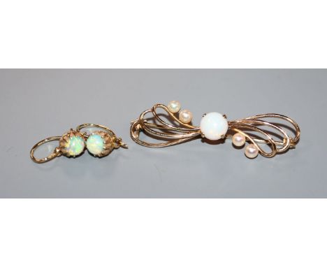 A 9ct gold, white opal and seed pearl brooch and a pair of yellow metal and white opal earrings.