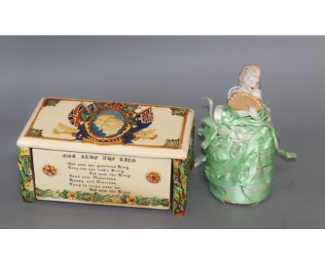 A Crown Devon musical box and pin cushion doll