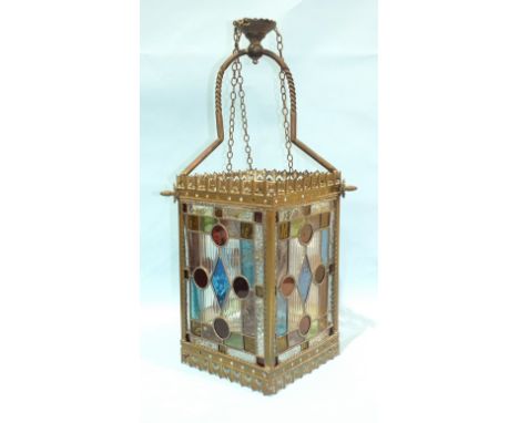 An early-20th century brass and leaded light gas lantern, with four multi-coloured glass panels and original gas fitment, 62c