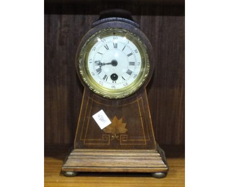 An Edwardian inlaid mahogany mantel clock, having a rounded top and tapering body, 27cm high.