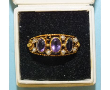 An amethyst and demi-pearl ring, in yellow metal mount, bearing Portuguese hallmarks for 800 fineness gold, size N, 5.4g, (da