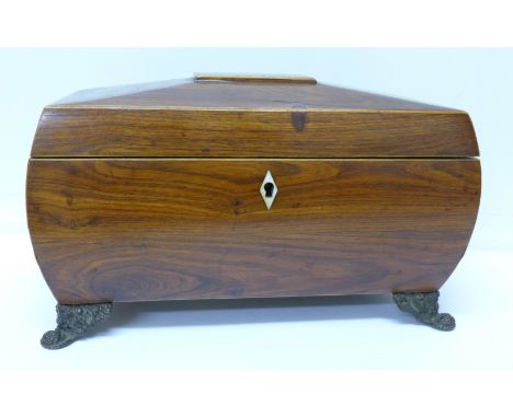 A 19th Century sarcophagus shaped rosewood tea caddy with later replacement bowl