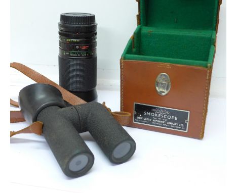 A Promaster Spectrum 7 MC zoom 3.5-200mm camera lens and a Mine Safety Appliances Company Smokescope