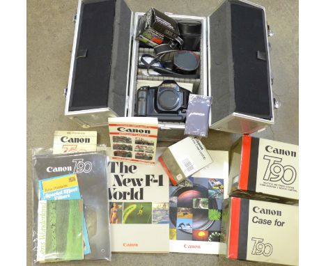 A Canon T90 camera body, with instructions and case, with six lenses; 50mm f1.8; 85mm f1.8; 52mm close up -450; 28mm f2.8; 24