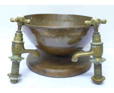 A mounted copper bowl with embossed inscription on 'a hand basin from one of the cells in Newgate Prison pulled down in 1923'