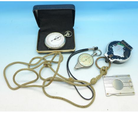 A stopwatch, map gauge, compass and a cigar cutter