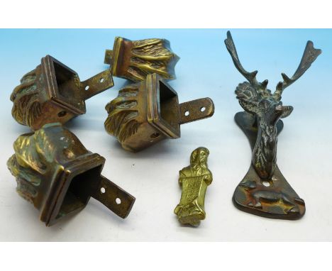 A set of four table leg mounts, a stag's head door knocker and a small metal Charles Dickens plaque