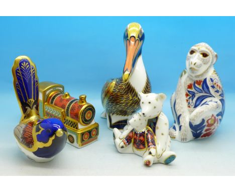 Five Royal Crown Derby paperweights, including Macaque with gold stopper and Steam Train, four with boxes