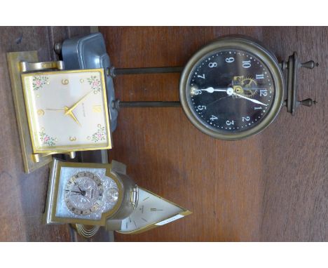 Four clocks; two Swiza, Bucherer and a self-wind gravity driven clock