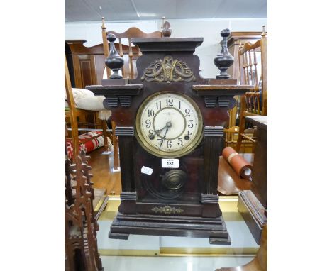 EARLY 20th CENTURY DARK STAINED WOODEN CASED MANTEL OR SHELF CLOCK, the dial marked 'Made in China', 18" (45.5cm) high 