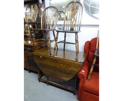 OAK GATE LEG DINING TABLE AND A SIMILAR SET OF EIGHT WHEEL BACK DINING CHAIRS (6 + 2) (9) 