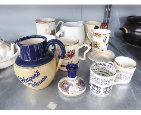 SEVEN CERAMIC ADVERTISING JUGS AND TANKARDS. THREE CERAMIC COMMEMORATIVE MUGS AND A CERAMIC "MOSS BROS" TOP HAT ORNAMENT (AS 