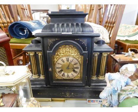EARLY 20th CENTURY EBONISED WOODEN CASED ARCHITECTURAL MANTEL CLOCK WITH H.A.C. LABELLED GERMAN MOVEMENT STRIKING ON A COILED