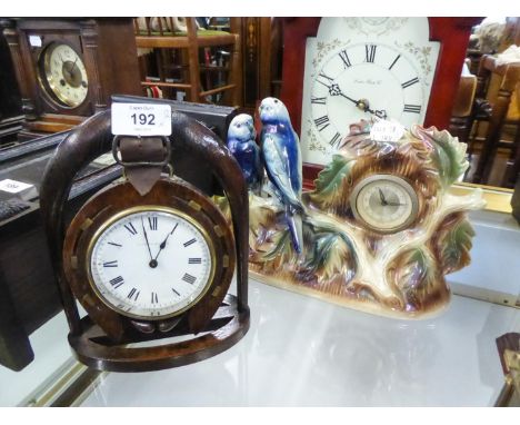 JEMA (HOLLAND) CERAMIC CASED CLOCK with two budgerigars, also an OAK PENDANT HORSESHOE AND STIRRUP TIMEPIECE, the dial inscri
