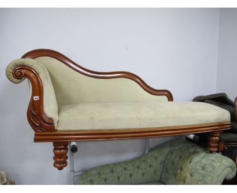 A XIX Century Mahogany Framed Chaise Longue, with wavy back, turned legs, re-upholstered in a pastel velvet, approximately 18