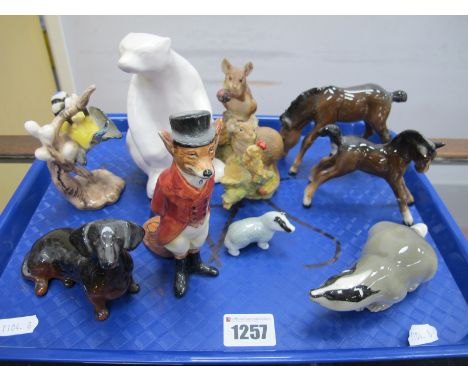 Royal Doulton Figure of Huntsman Fox, D6441, Beswick Dachshund, two Beswick foals (damaged), matt white Polar Bear, a Goebel 