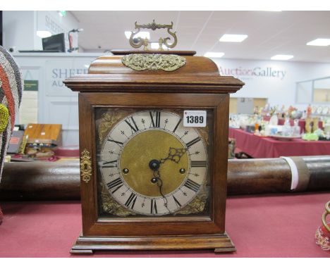 A XX Century Mahogany Cased Carriage Clock, with carry handle, Westminster chimes movement, black Roman numerals to silvered 