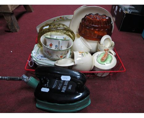 Kitchenalia - An early enamel gas iron and stand, "The Rhythm" by Radiation, two amber glass advertising jelly moulds "For Us
