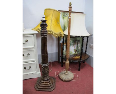 A Mahogany Standard Lamp, with fluted and leaf carving, on stepped base, another in light oak.
