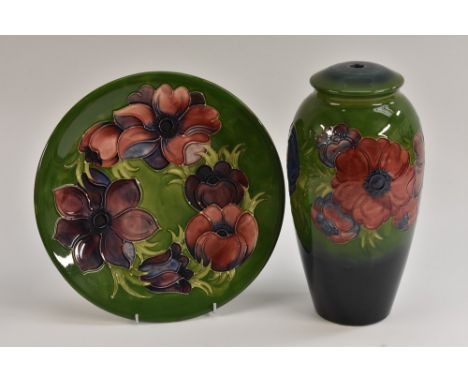A Moorcroft Anemone pattern ovoid lamp base, tube lined with large flowerheads in blue and red, on a green ground, 27cm high,