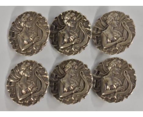 An Art Nouveau set of six silver lady's dress buttons, each shaped circular button cast with the muse Polymnia in profile pla