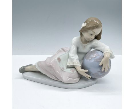 Glossy finish, presents a girl dressed a embroidery dress laying admiring a world globe, Lladro backstamp. Artist: Antonio Ra