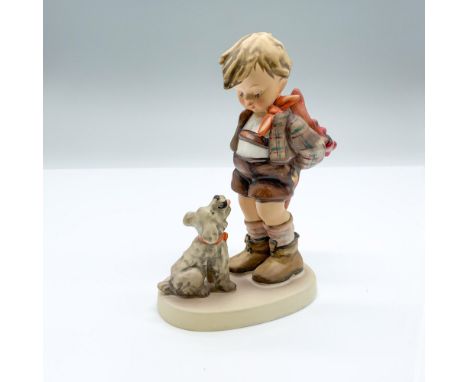Hand-painted figurine depicting a boy hiding something from the dog behind his back. Goebel backstamp on the bottom. Dimensio