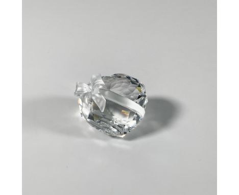 A clear figure adorned with a frosted bow and ribbon. Part of the Exquisite Accents series. Swarovski Crystal marking. This i