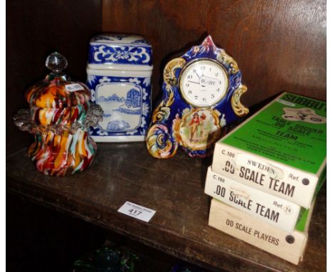 Three boxed Subbuteo football teams, an "end of day" glass jar, a china mantle clock and a box