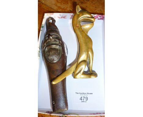 Cast iron nutcracker in the form of an old man, and another brass, as a grotesque cat