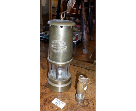 Brass miner's lamp and a souvenir miniature brass miner's lamp commemorating the 1984 miner's strike 