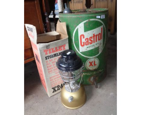 Old Castrol motor oil can with tap and a Tilley lamp