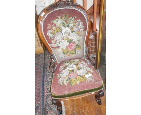 19th c. carved walnut show frame spoonback nursing chair, upholstered in tapestry and beadwork on carved cabriole legs