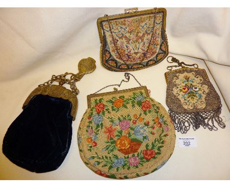 Four Victorian and Edwardian evening bags, including tapestry and beadwork examples, together with a velvet bag having huntin