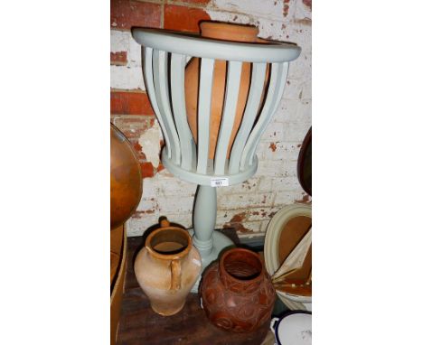 Painted wood planter on stand and three terracotta pots