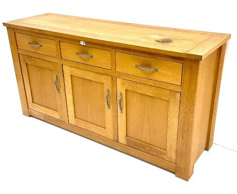 Light oak sideboard, three drawers above three cupboards enclosing shelving, stile supportsDimensions: Height:&nbsp;80cm&nbsp