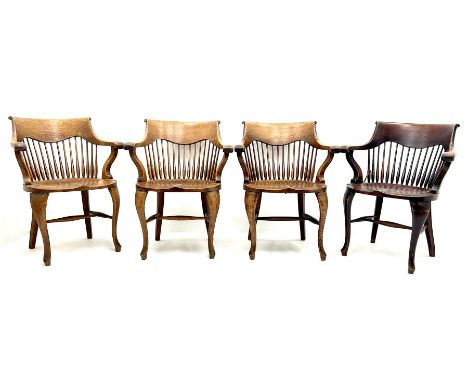 Set eight early 20th century oak captains chairs, carved scrolling cresting rail, tapering stick back, cabriole legs joined b