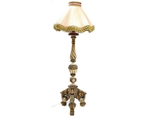 Late 20th century parcel gilt standard lamp, twist column with carved leaf decoration, on three scrolled leafage supports, wi