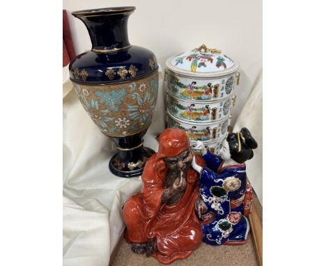 A Royal Doulton slaters patent vase decorated with flowers and leaves together with a Japanese pottery figure group and a Chi