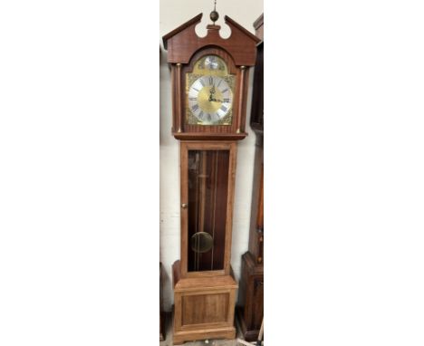 A modern mahogany cased longcase clock with a silvered dial and glazed door