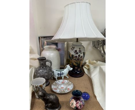 A Moorcroft bramble pattern table lamp together with a Moorcroft vase a Quimper beaker, a Poole pottery vase and assorted dec