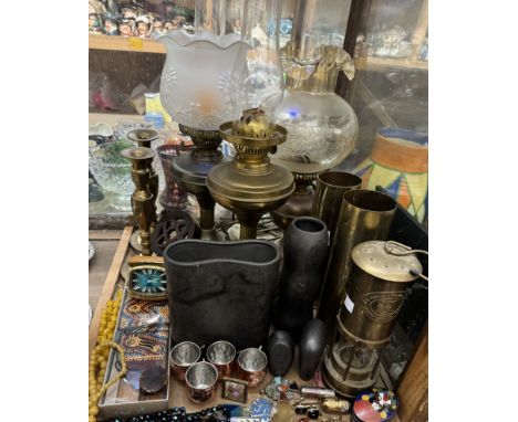 Three brass oil lamps together with brass shell cases, miners lamp, brass candlesticks, brass wares, costume jewellery etc 