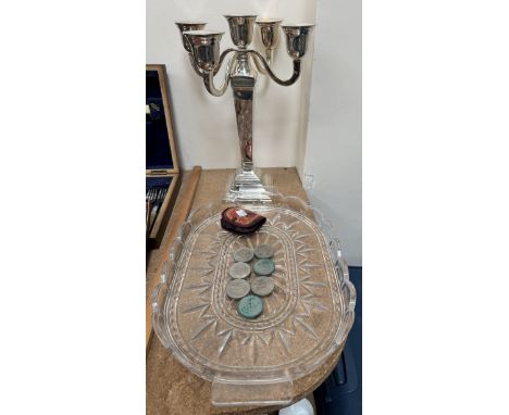 An electroplated four branch candelabra together with a glass tray and crowns