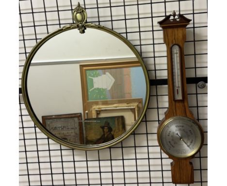 A brass framed wall mirror together with a Comitti of London barometer