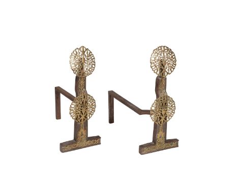 A pair of Arts and Crafts cast iron and brass mounted andirons, early 20th century, in the manner of work by Ernest William G