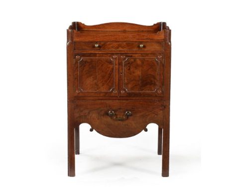 A George III mahogany night commode, circa 1780, with shallow drawer above two cupboard doors and a slide, 82cm high, 56cm wi