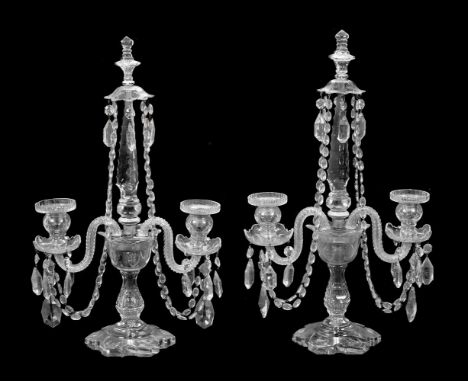 A pair of Edwardian cut glass table candelabra, early 20th century, each with twin arms above facetted base, 53cm high, 32cm 