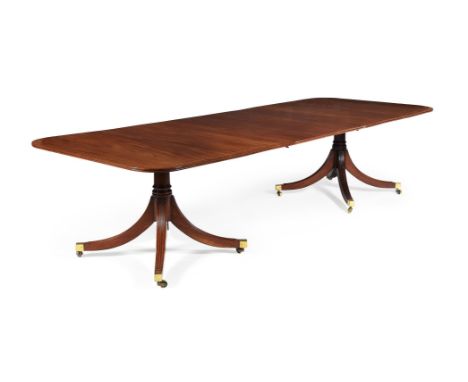 A mahogany and line inlaid twin pedestal dining table, in late George III style, 20th century, with one additional leaf inser